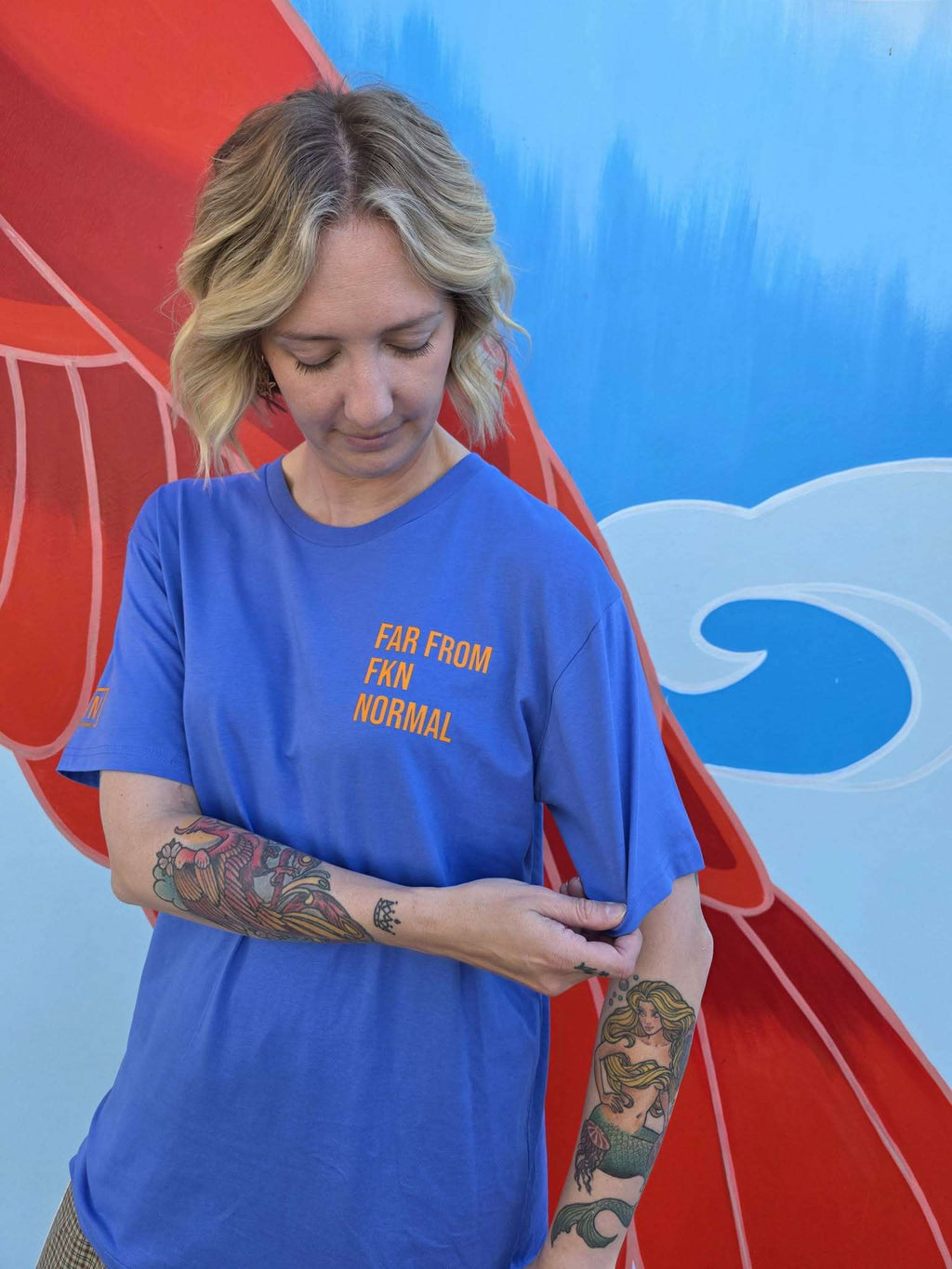 Unisex Aegean Blue T-shirt on model [model:female]