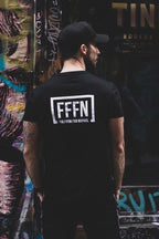 Black Unisex Rear Logo T-Shirt on model [model:male]
