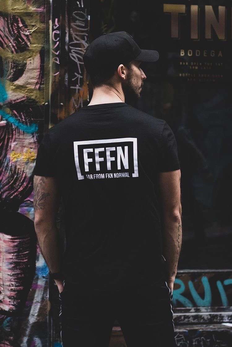 Black Unisex Rear Logo T-Shirt on model