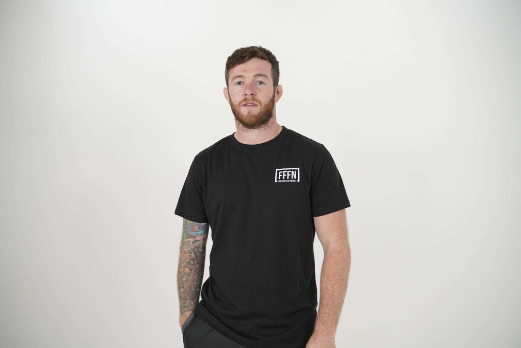 Black Unisex Rear Logo T-Shirt on model [model:male]