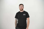 Black Unisex Rear Logo T-Shirt on model [model:male]