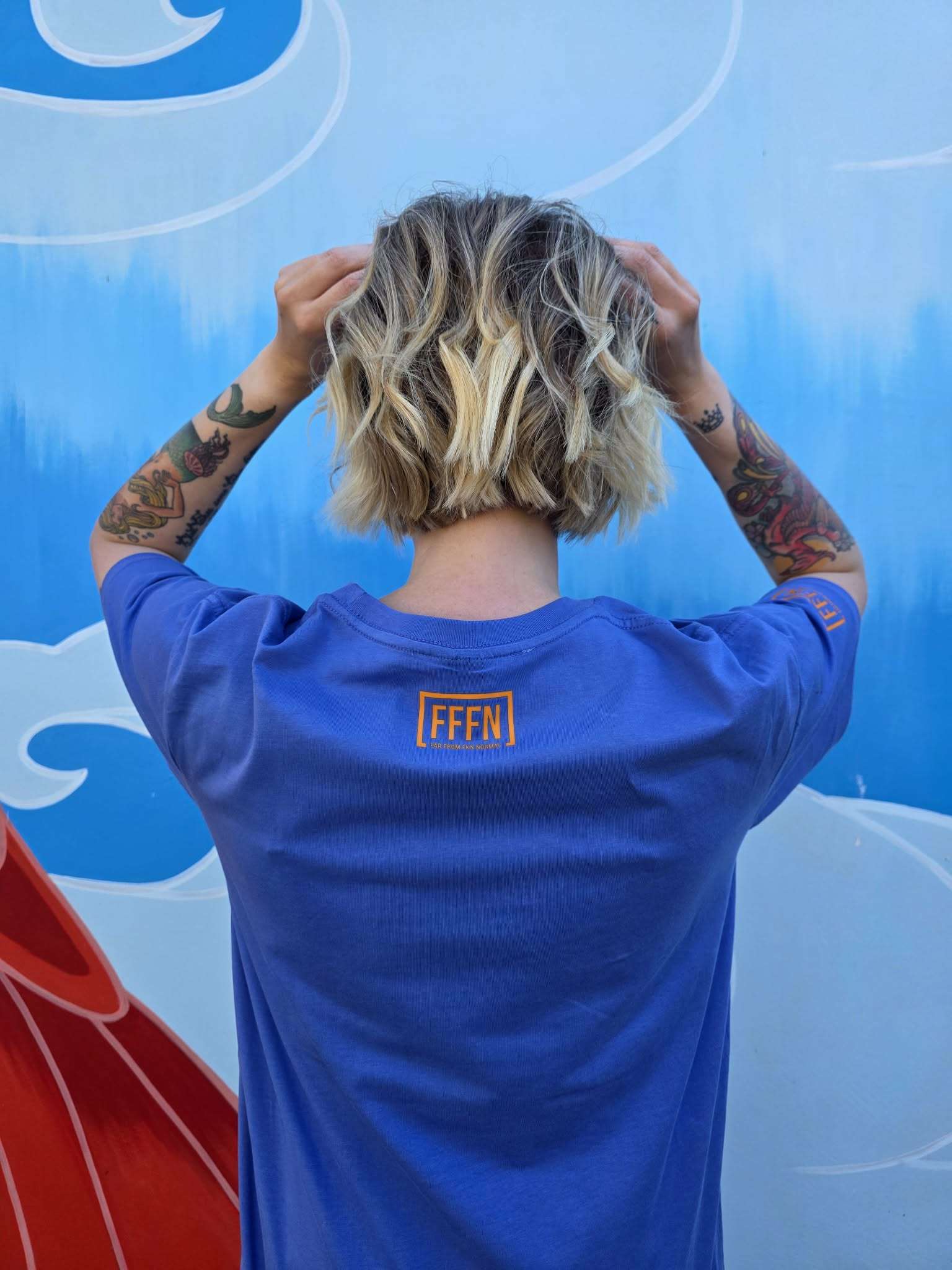 Unisex Aegean Blue T-shirt on model