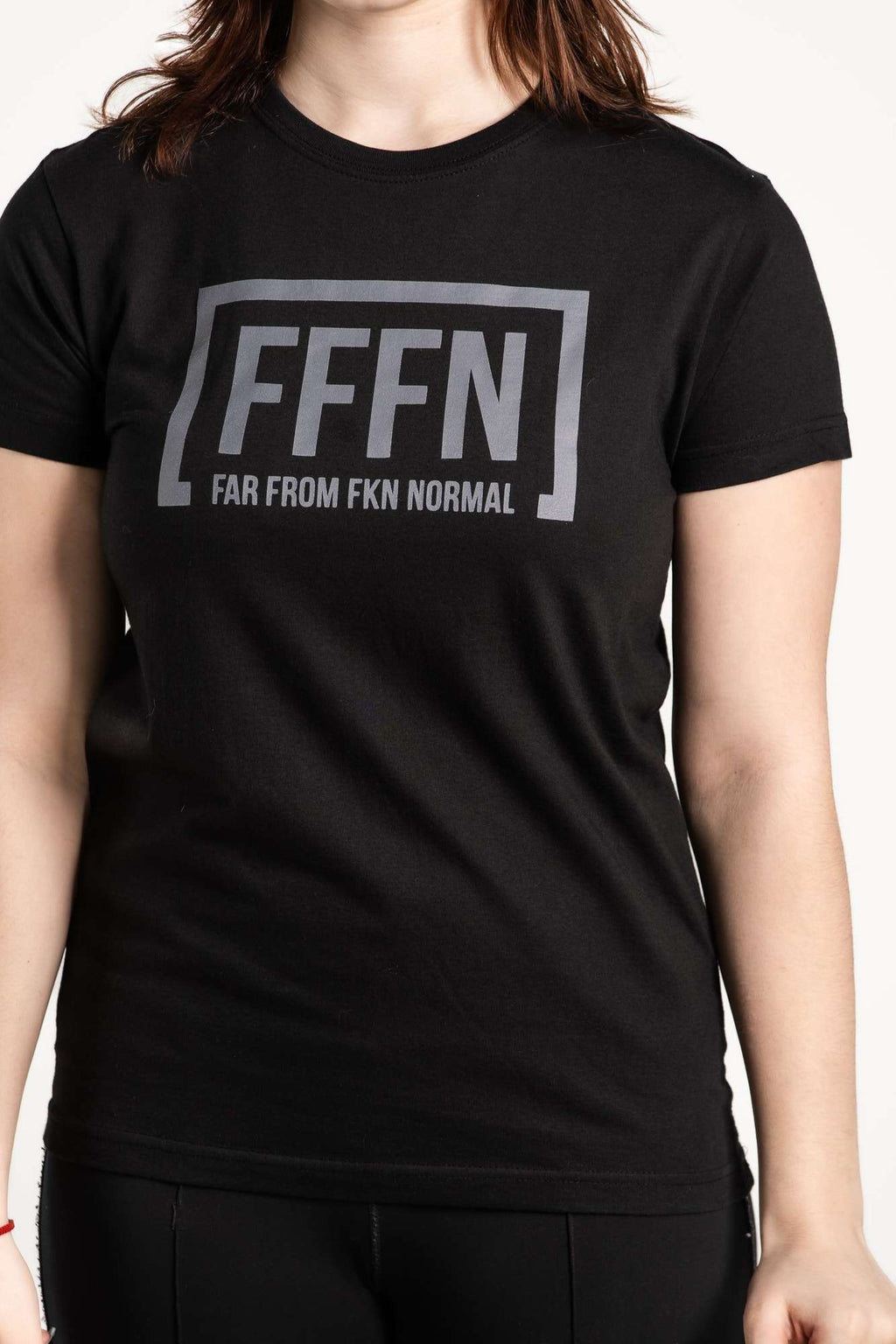 Black Unisex Front Logo T-Shirt on model [model:female]