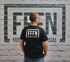 Black Unisex Rear Logo T-Shirt on model [model:none]
