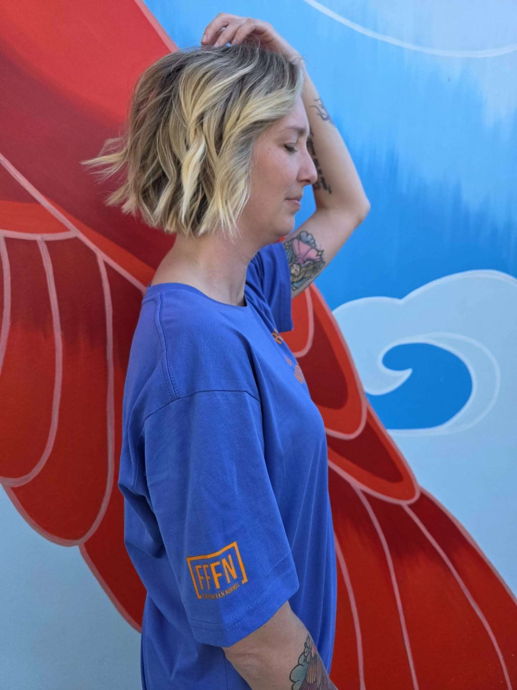 Unisex Aegean Blue T-shirt on model [model:female]