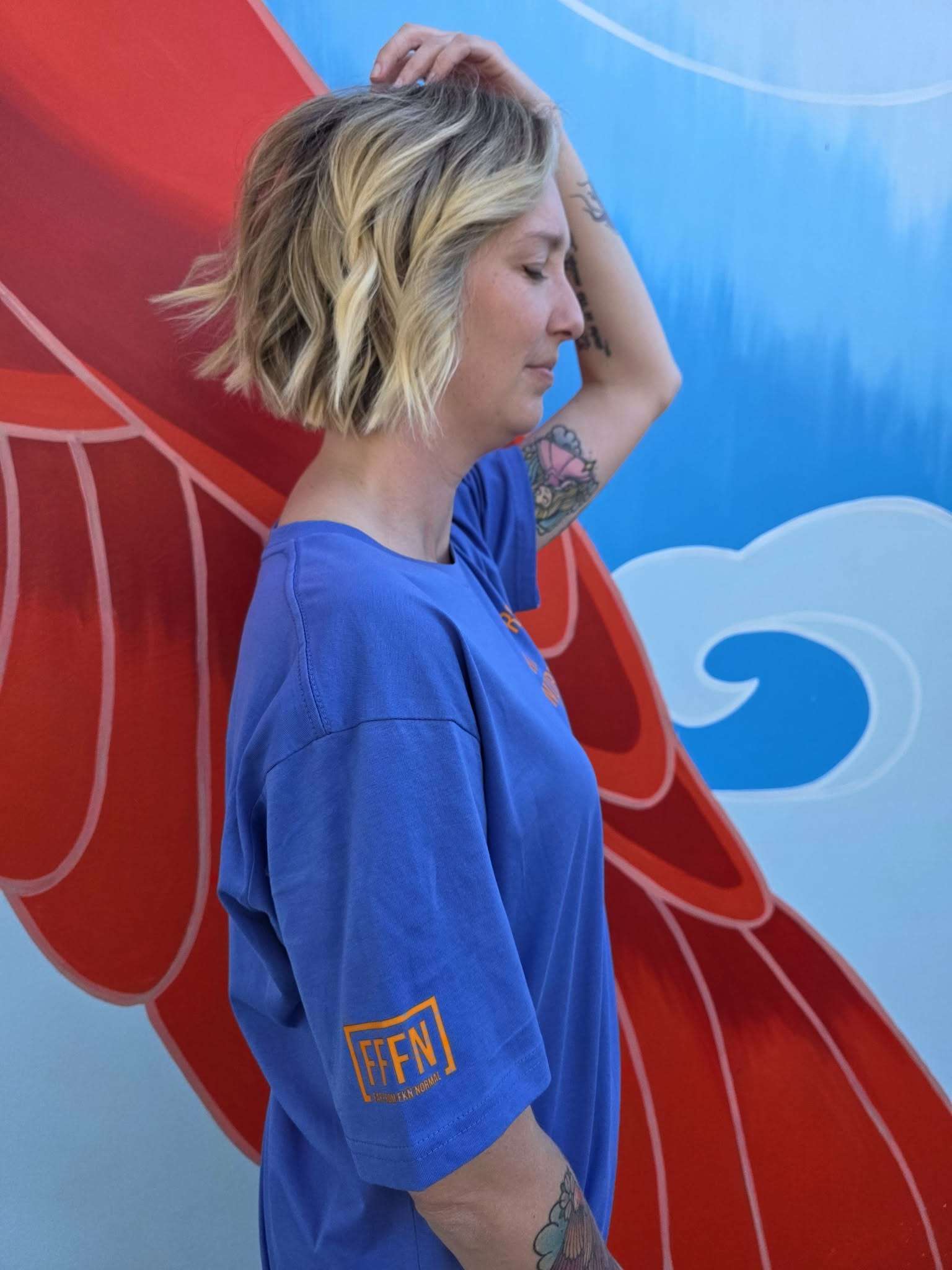 Unisex Aegean Blue T-shirt on model