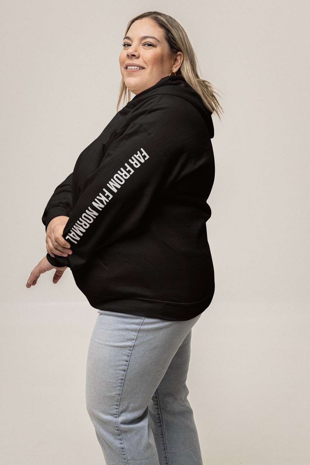 Black extra love unisex urban hoodie on model