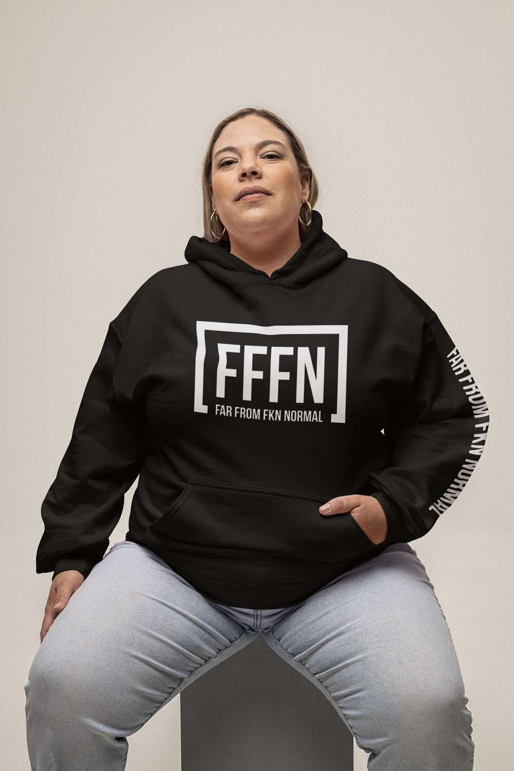 Black extra love unisex urban hoodie on model